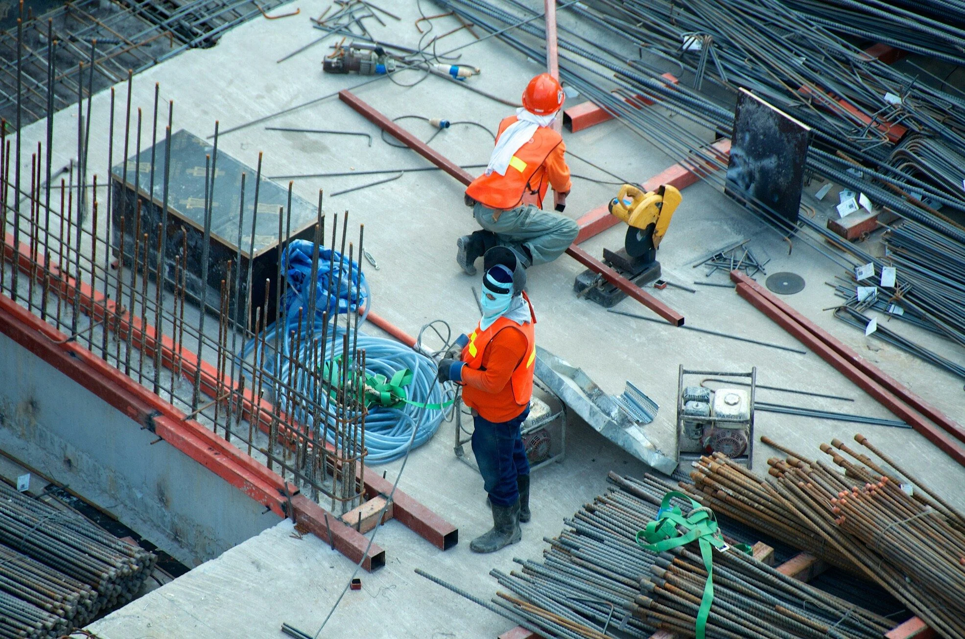 Construction workers on scaffolding at a building site