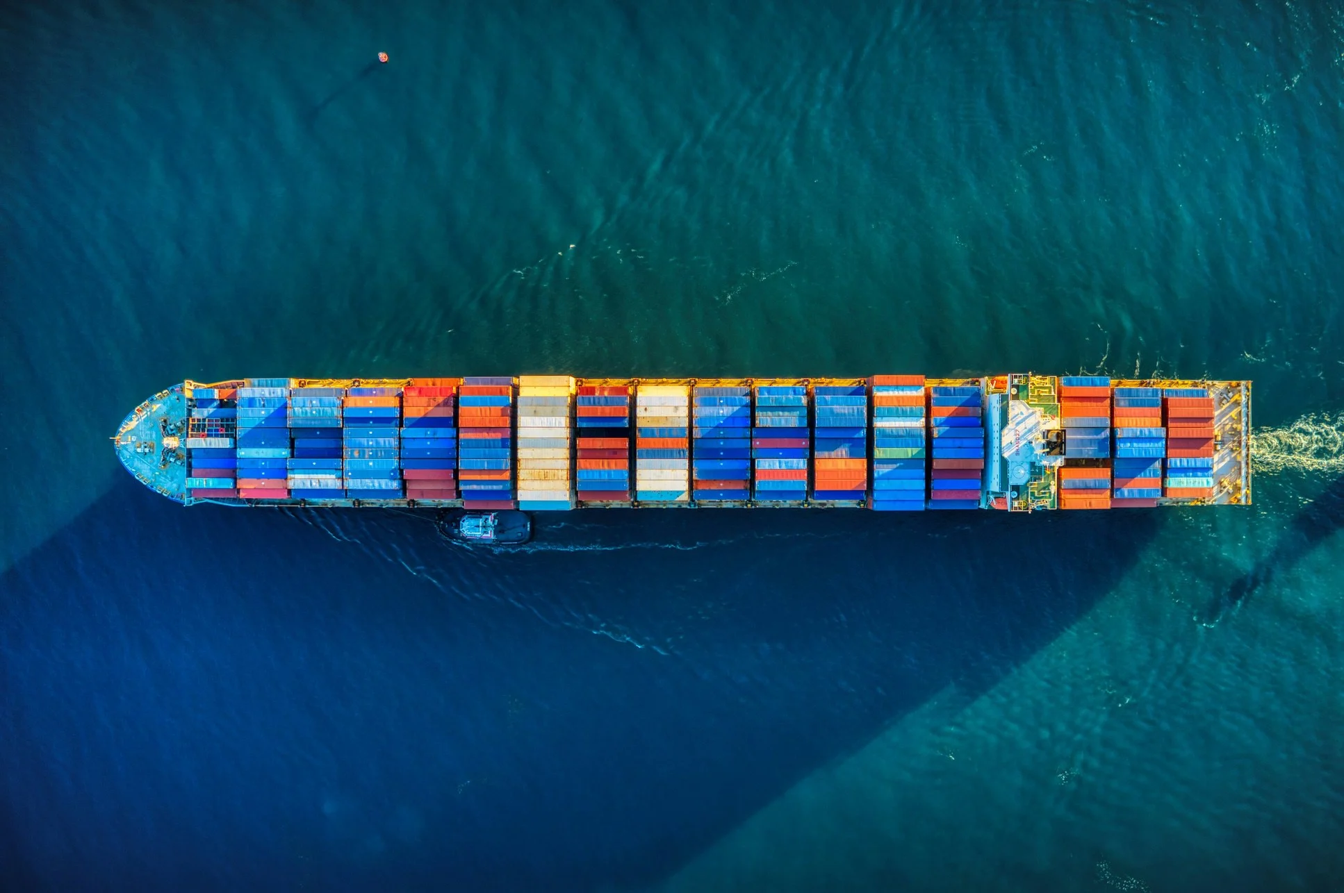 Aerial view of a loaded container ship at sea, marine cargo insurance