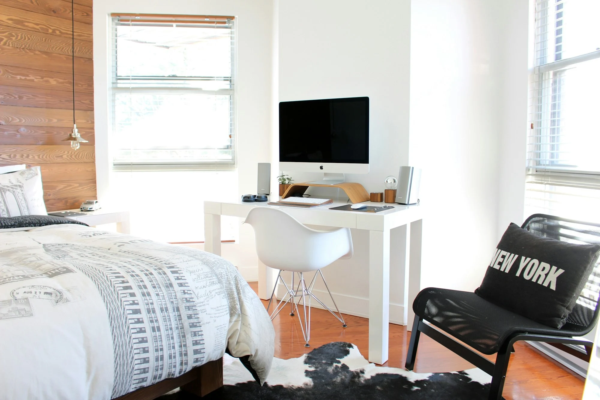 Furnished room with a bed and desk in shared accommodation, rooming house insurance