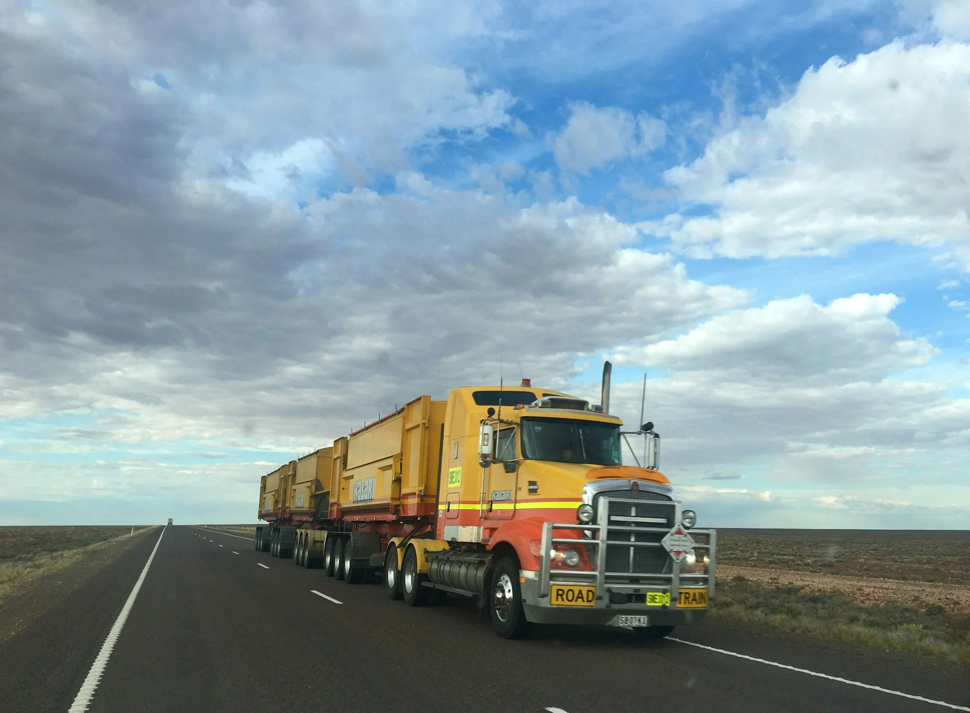 Road train truck on an Australian outback highway, truck insurance